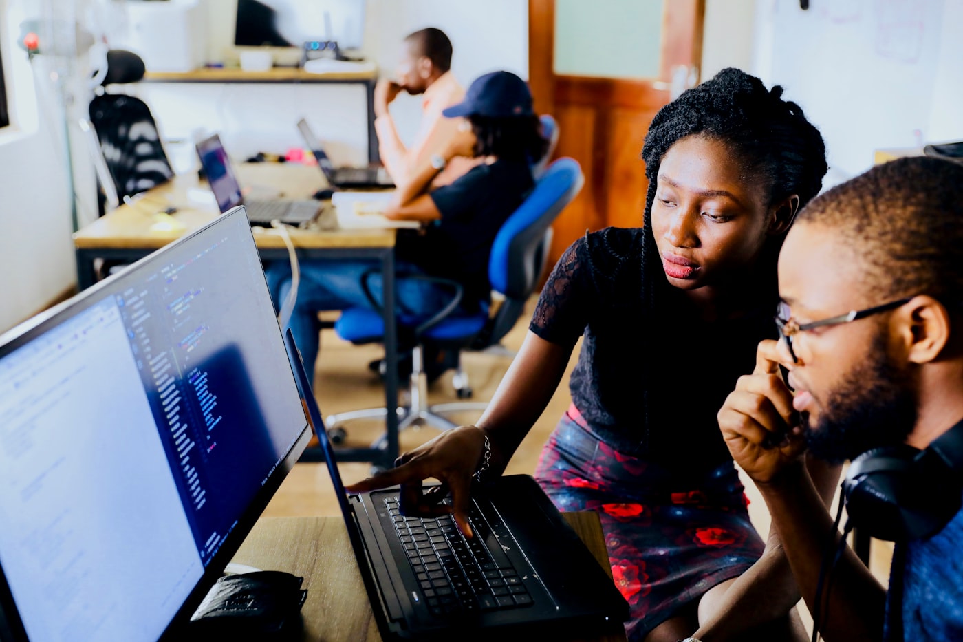Engineering leader reviewing sprint backlog with augmented development team members