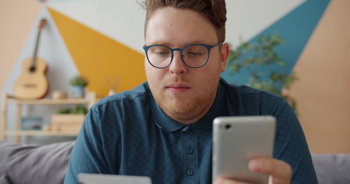 Person using a payment app on a smartphone — digital wallet app development