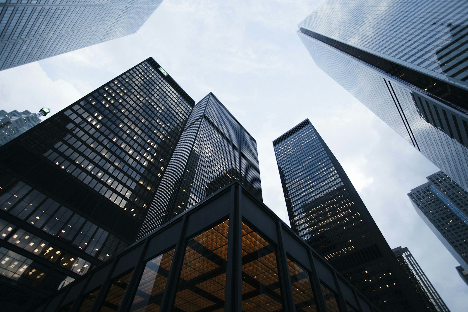 Financial-district towers seen from below — the banks and account-servicing providers (ASPSPs) that expose open banking APIs