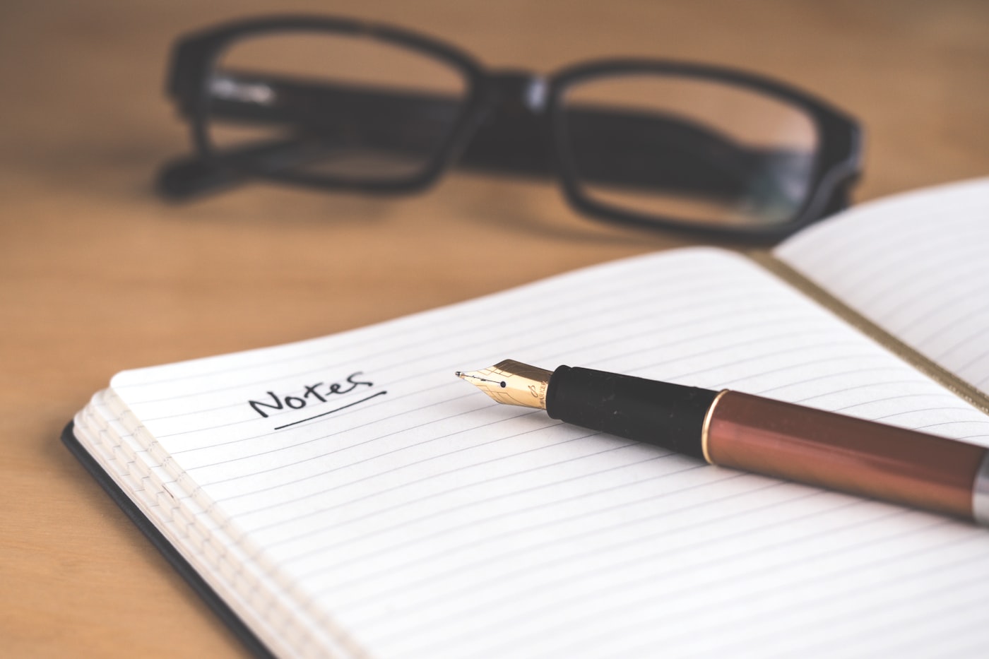 engineer writing a shift handoff document in a distributed software team