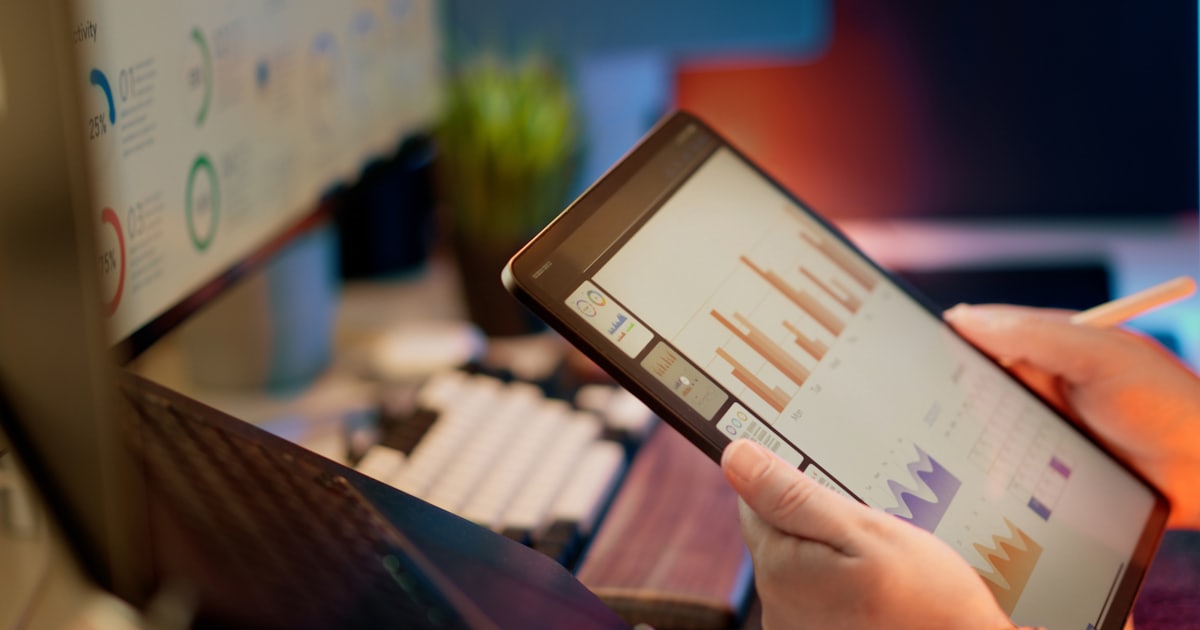 Financial data dashboard on a tablet — KYC and AML compliance software
