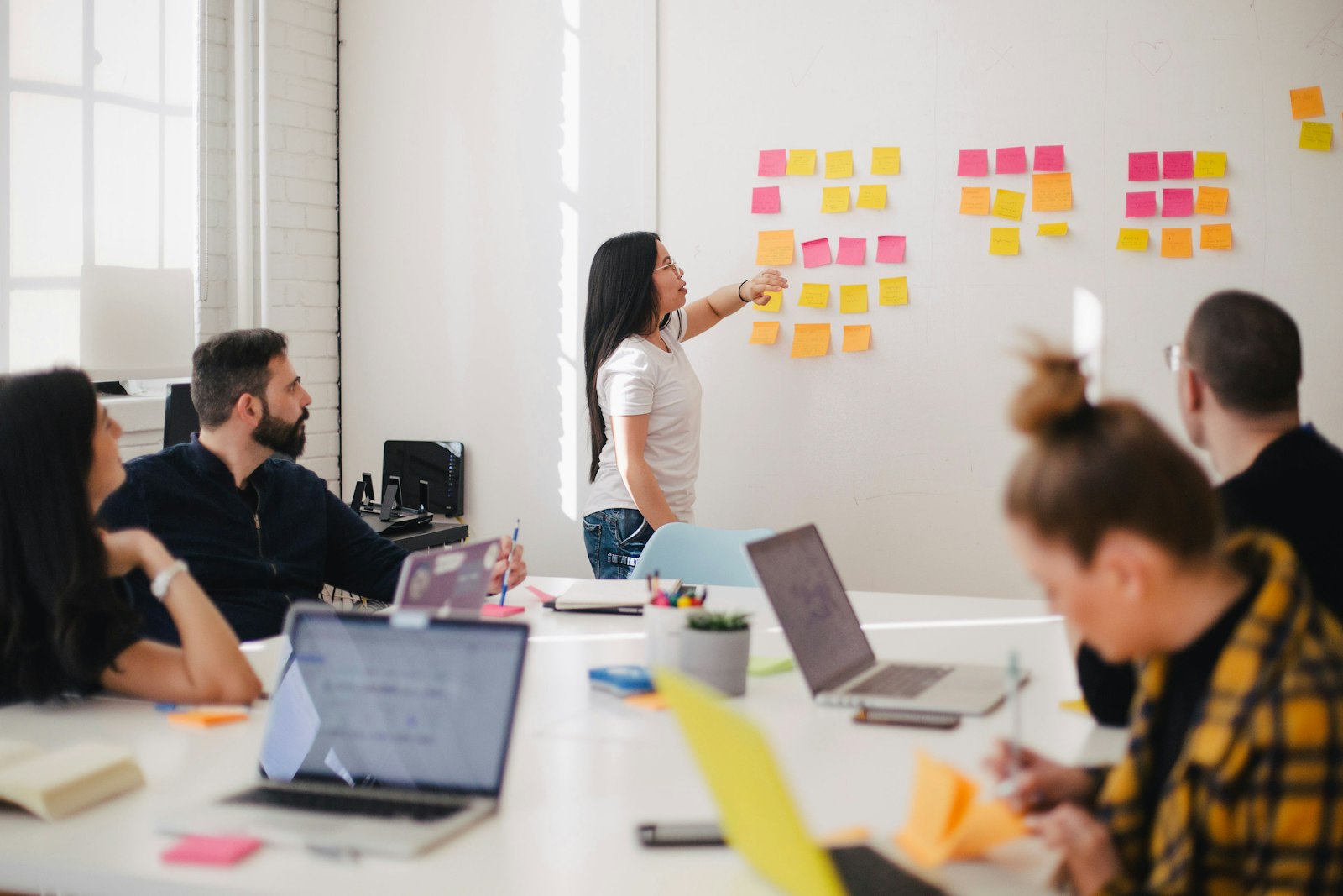 Startup product team mapping MVP scope on sticky notes during a sprint planning session