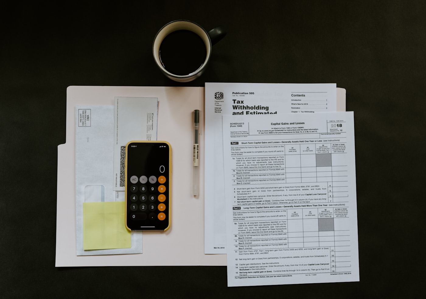 budget planning desk with calculator, documents and coffee — building a software development budget