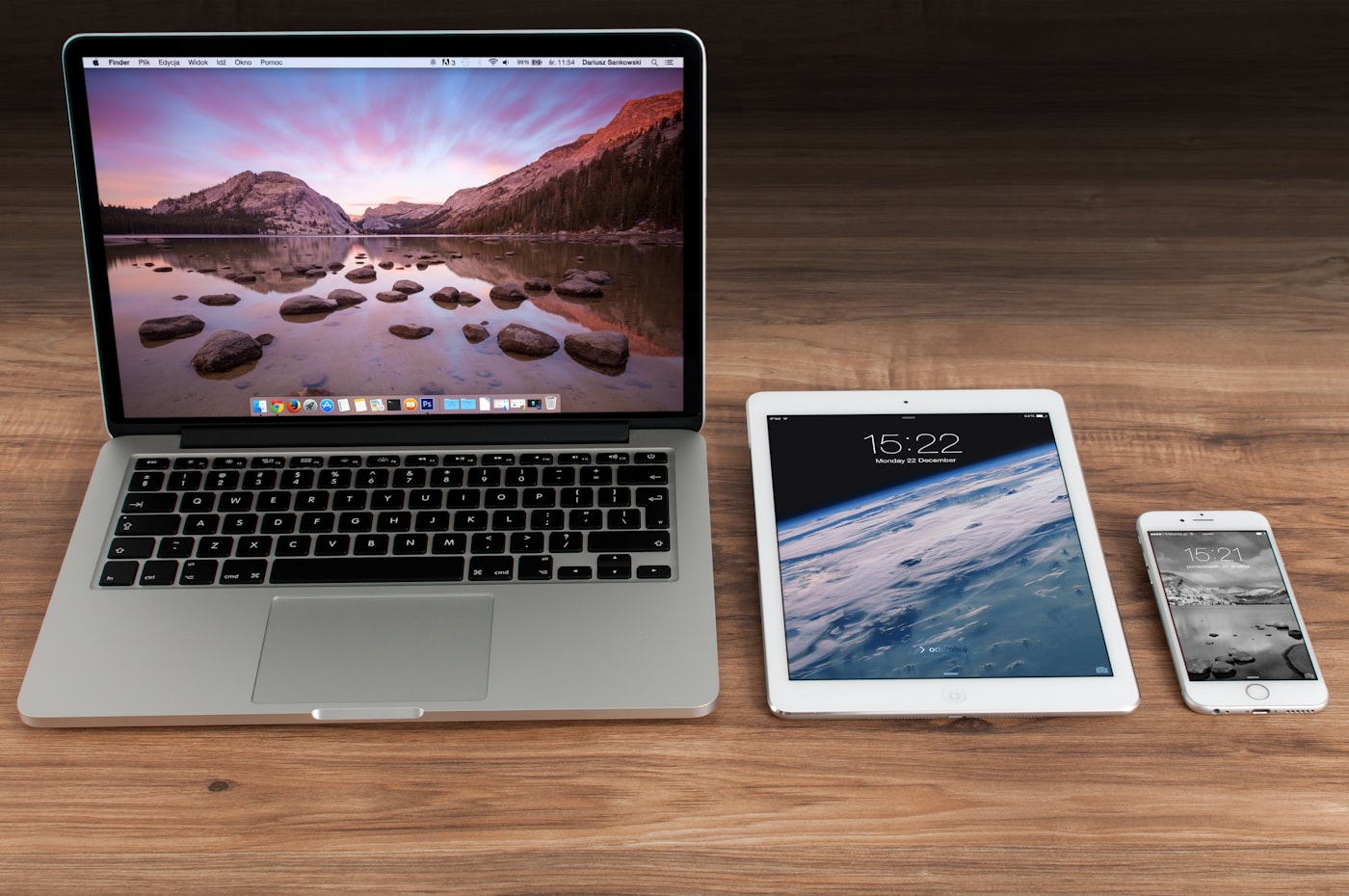 One responsive web application displayed consistently across a desktop monitor, tablet and smartphone