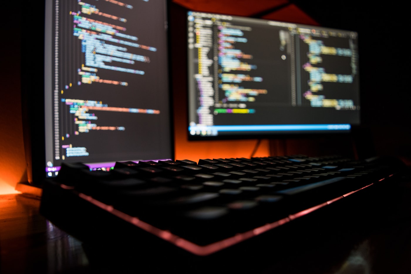 Person using a screen reader to navigate a web application dashboard, with braille display connected to a laptop