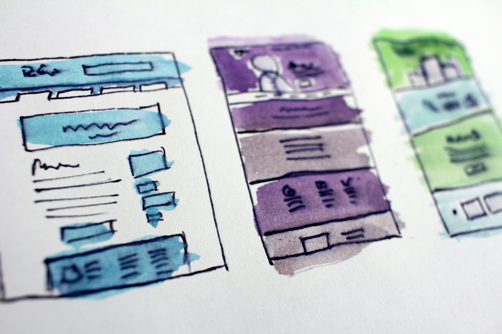 Hand-drawn wireframes of web and app layouts — sketching the marketplace MVP flows before building